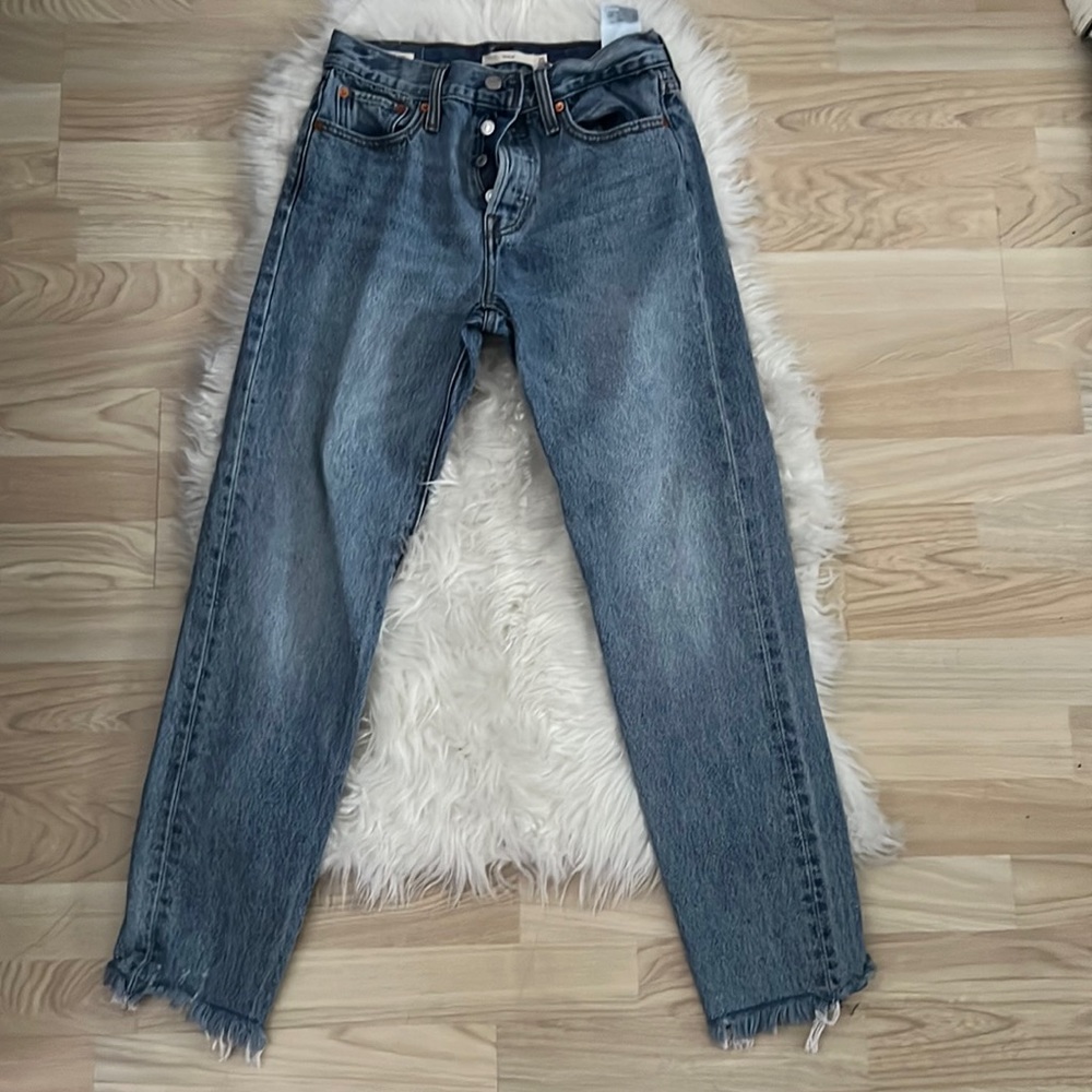 Medium wash Levi’s jeans.